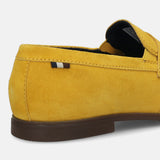 Yellow leather loafer by bugatti, featuring a penny loafer strap and tonal stitching.