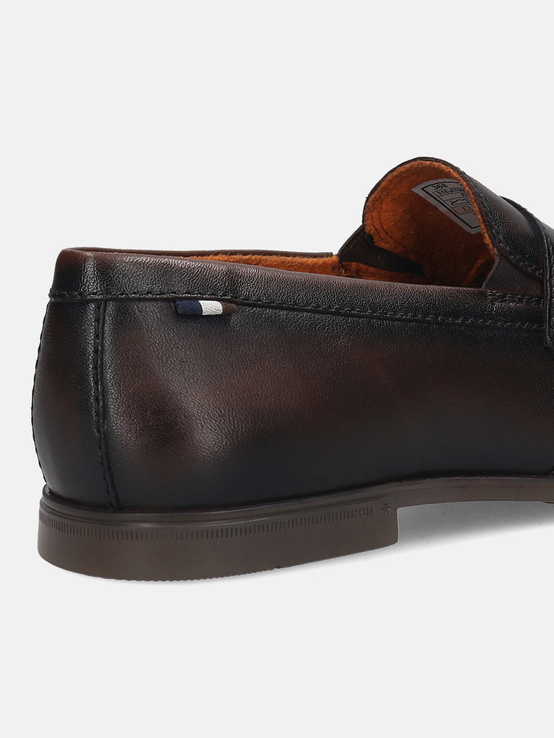 Dark brown leather penny loafer by bugatti with a decorative stripe on the heel.