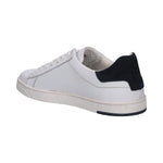 Bugatti Orazio white sneakers in premium leather with navy heel accent, shown in back angle view.