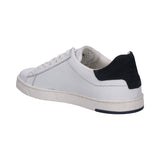 Bugatti Orazio white sneakers in premium leather with navy heel accent, shown in back angle view.