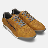 Pair of bugatti Trevor yellow suede sneakers with gray laces and perforated texture.
