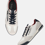 bugatti Trevor white comfort sneakers with navy laces, red lining, and a side zipper.

