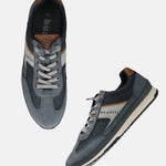 Bugatti Riptide blue comfort sneakers with suede and perforated texture, lace-up style, tan and gray accents.
