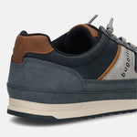 Cropped back view of a blue bugatti sneaker with brown leather accents and a thick, beige sole.
