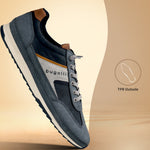 Side view of a blue bugatti sneaker, with brown accents, light gray laces, and a white midsole.