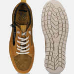 Yellow leather sneakers by Bugatti, showcasing a white sole, textured upper, and white laces.