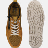 Yellow leather sneakers by Bugatti, showcasing a white sole, textured upper, and white laces.