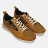 Yellow leather sneakers by bugatti, featuring white laces and tonal mesh accents.