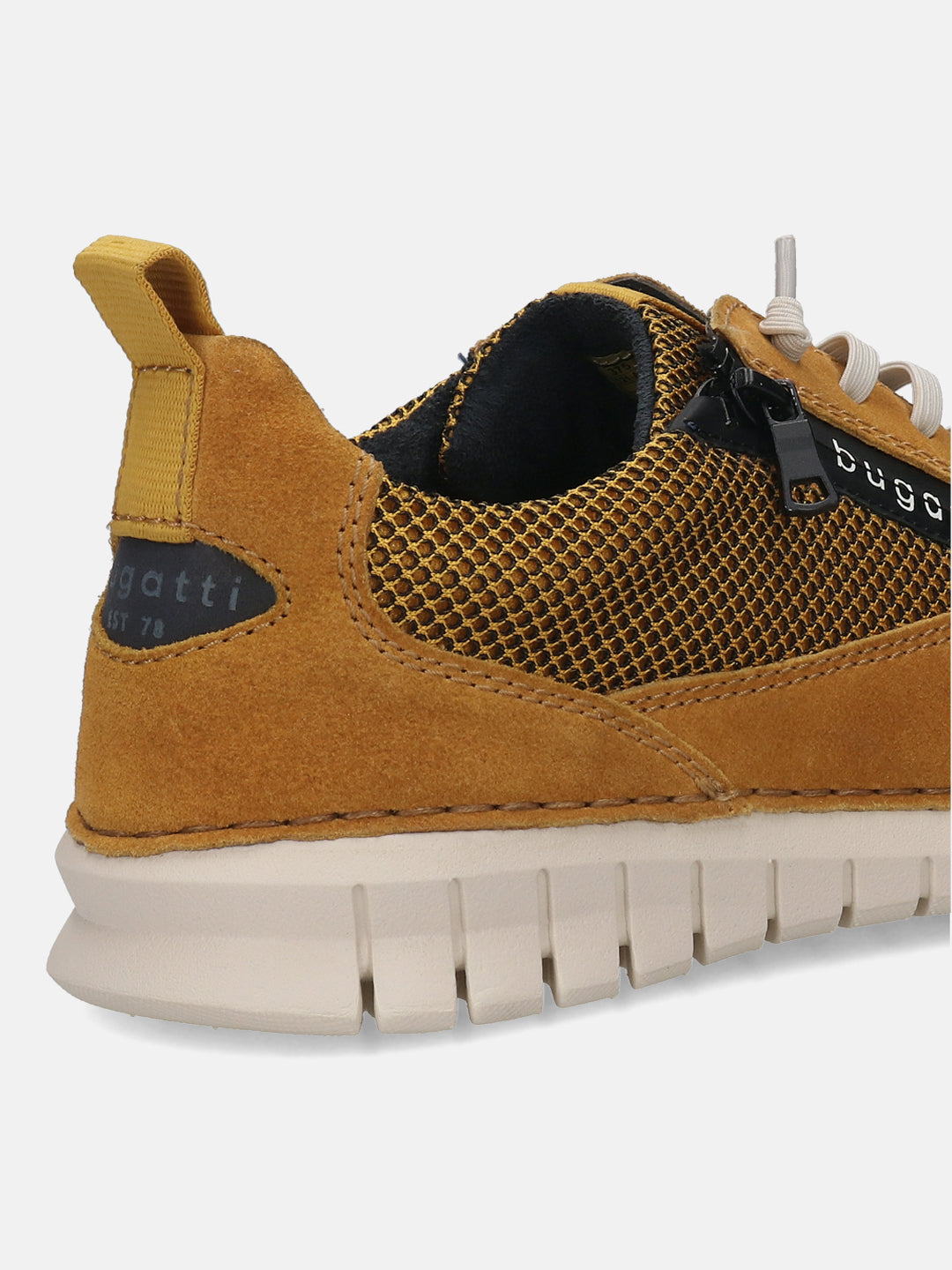 Yellow leather sneaker by bugatti, featuring a suede heel panel, net-like material, and a cream-colored ridged sole.