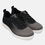 bugatti Astra Comfort Athleisure Sneakers in dark gray, featuring a mesh upper, lace-up closure, and white midsole.
