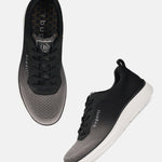 bugatti Astra dark gray sneakers, with a gradient knit texture and white soles, shown from above and side.
