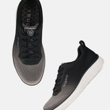 bugatti Astra dark gray sneakers, with a gradient knit texture and white soles, shown from above and side.
