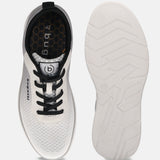 Bugatti Astra white athleisure sneakers shown with a honeycomb pattern insole and ridged white sole.

