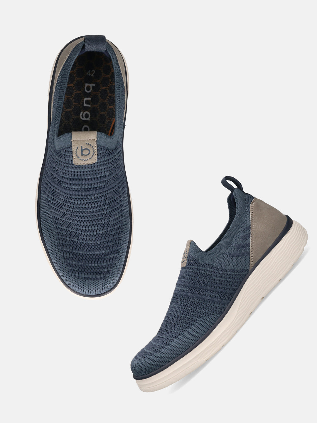 Bugatti Astra blue slip-on casual shoes, featuring a textured knit upper, elasticized opening, and a beige rubber sole.