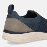 Cropped view of a blue knit bugatti slip-on shoe with a textured sole and a grey heel detail.
