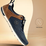 Side view of a bugatti Glenans dark blue Comfort Sneaker featuring brown leather accents and a perforated design.