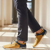 Lifestyle shot of bugatti Glenans yellow Comfort Sneakers featuring a perforated upper and navy accent.
