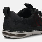 Back view of a black bugatti sneaker with breathable red and black mesh, a padded collar, and a comfortable white and gray sole.