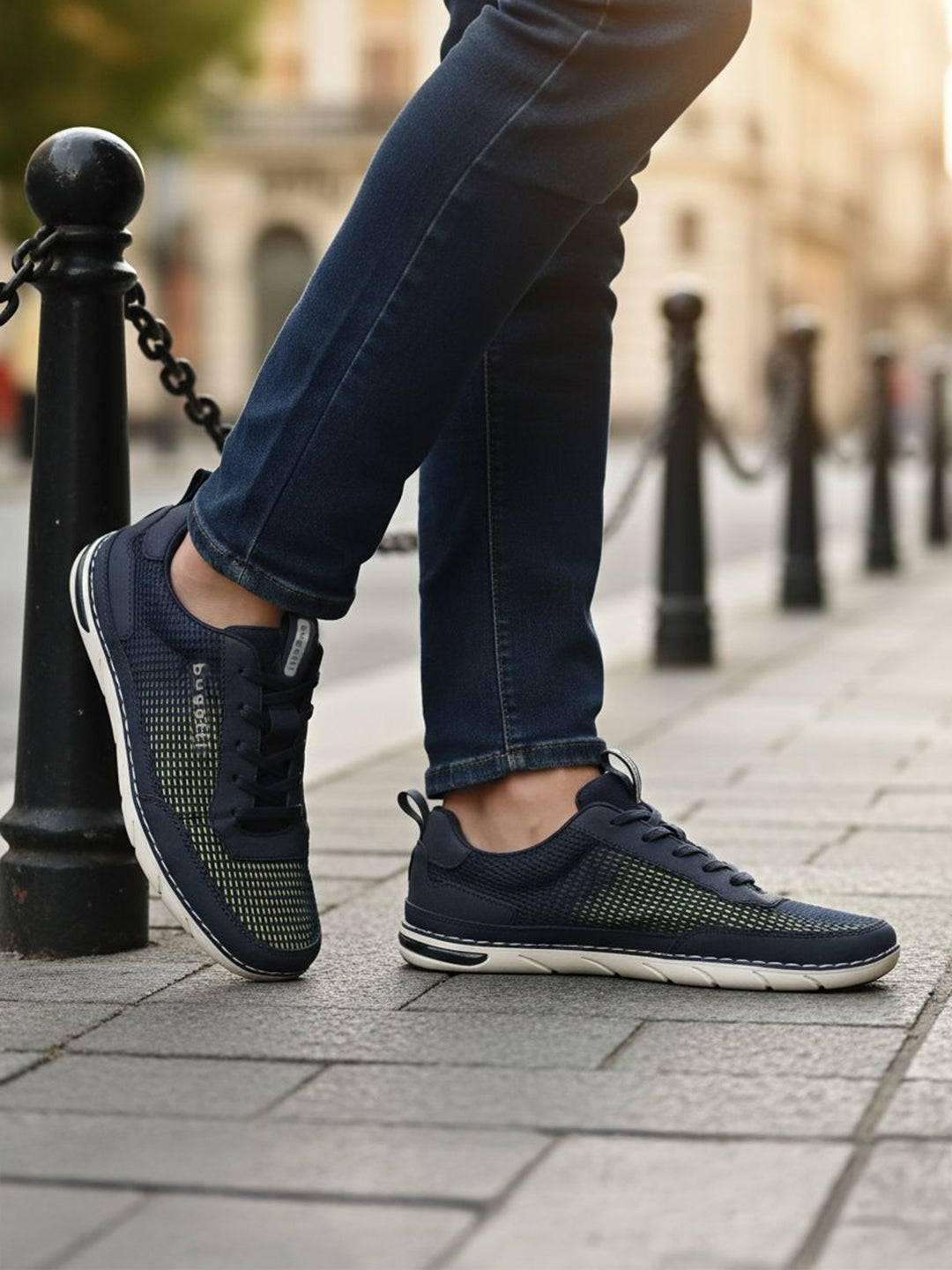 Lifestyle close-up of the bugatti Glenans dark blue comfort sneakers, featuring a sporty style and mesh texture.