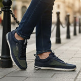 Lifestyle close-up of the bugatti Glenans dark blue comfort sneakers, featuring a sporty style and mesh texture.
