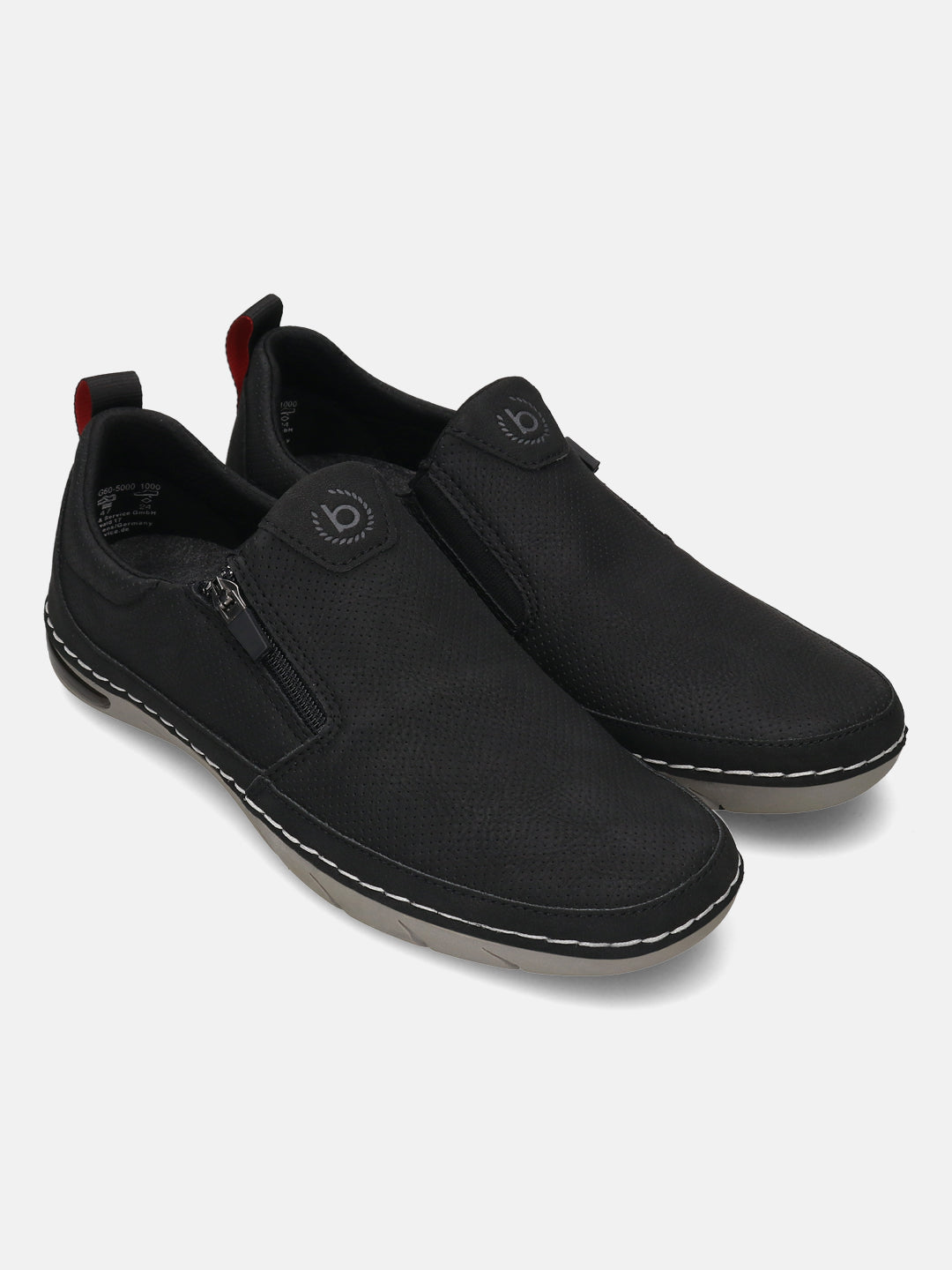 Bugatti Glenans black casual slip-on shoes with zipper detail and red pull tab.
