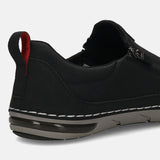 Bugatti Glenans black comfort slip-on shoe, with a perforated upper, heel pull tab with red accent, and air bubble sole.
