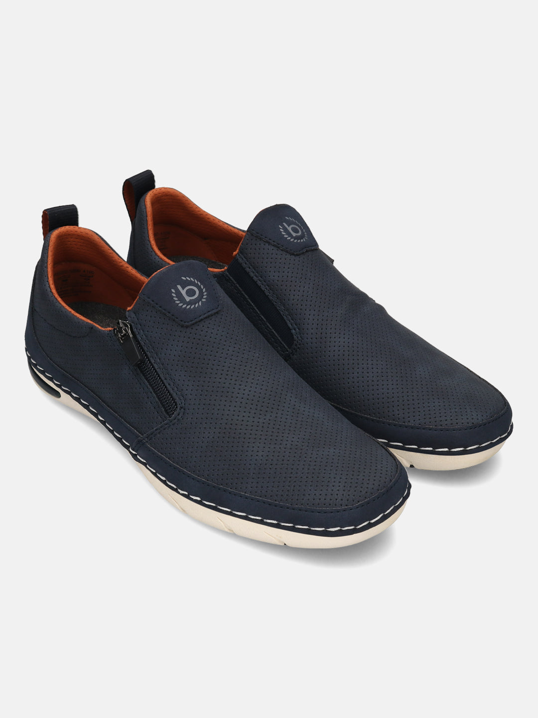Bugatti Glenans dark blue casual slip-on shoes with perforated detailing, side zipper, and orange lining.
