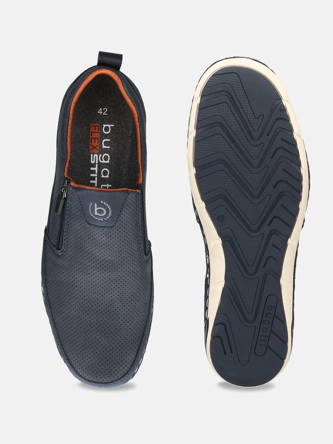A pair of bugatti Glenans slip-on shoes in dark blue, showcasing a perforated texture and orange lining, with a view of the soles.
