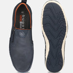 A pair of bugatti Glenans slip-on shoes in dark blue, showcasing a perforated texture and orange lining, with a view of the soles.
