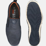 A pair of bugatti Glenans slip-on shoes in dark blue, showcasing a perforated texture and orange lining, with a view of the soles.
