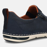 Back view of a dark blue bugatti slip-on shoe with perforated detail, tan lining, a zipper, and a heel pull tab.

