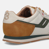 Cropped back view of a bugatti Sacramento off-white sneaker with brown suede heel and dark green accents.
