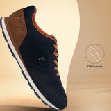 Side view of a bugatti Sacramento Comfort Sneaker in dark blue with brown accents and a white sole.
