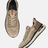 Bugatti Sandar beige athleisure sneakers, featuring suede-like texture, white patterned side panels, and black sole accents.