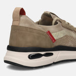 Cropped back view of a beige bugatti athleisure sneaker with a black and off-white sole.
