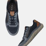bugatti Compton comfort sneakers in dark blue, featuring laces, a side zipper, and a brown heel accent.
