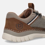 Cropped view of a bugatti Rickson comfort sneaker in beige, showing brown suede and breathable mesh panels.