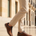 Bugatti Rickson cognac comfort sneakers, side view. Brown textured leather shoes with laces and side zipper, worn with tan pants.
