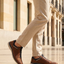 Bugatti Rickson cognac comfort sneakers, side view. Brown textured leather shoes with laces and side zipper, worn with tan pants.

