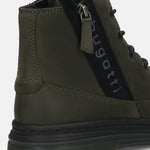 Cropped view of a Bugatti Drake boot in dark green premium leather, showing the side zipper and lug sole.
