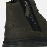 Cropped view of a Bugatti Drake boot in dark green premium leather, showing the side zipper and lug sole.
