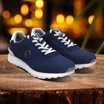 bugatti Atus dark blue sneakers with white laces and soles on a wooden surface with a blurred background.
