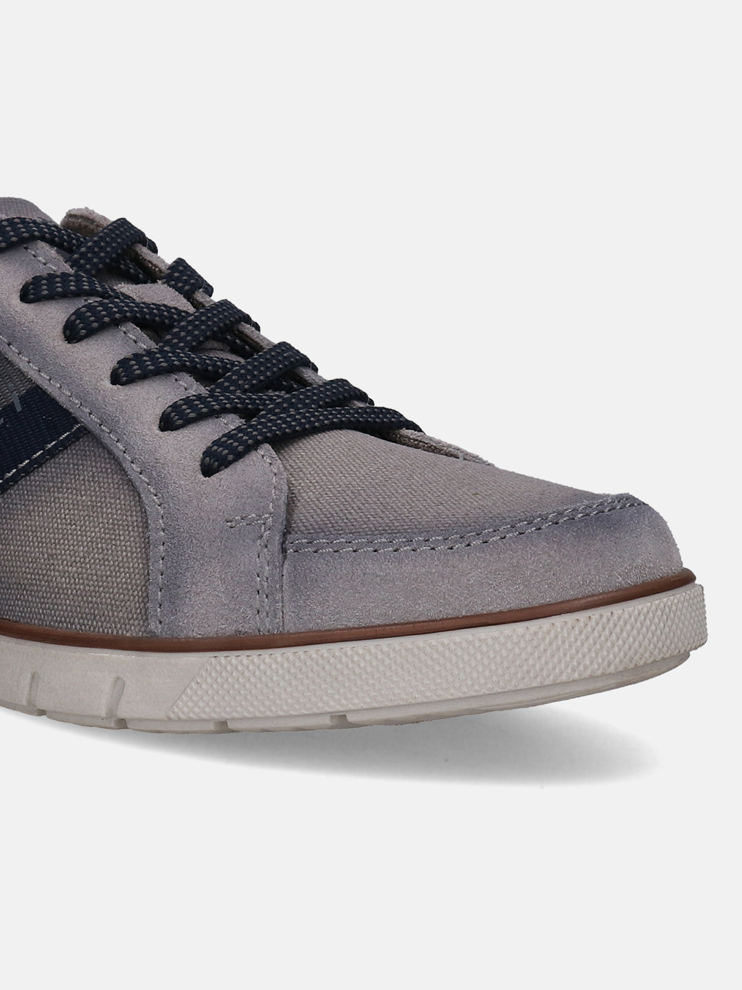 Grey low top sneaker by bugatti with textured sole and dark blue shoelaces, shown in a cropped view.