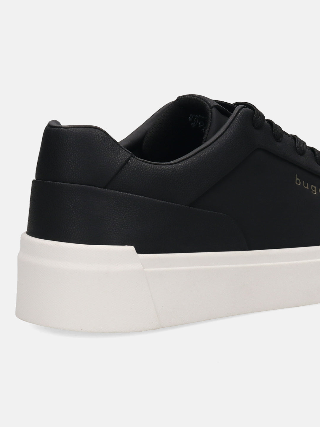 Cropped side view of a black bugatti sneaker with a solid white sole.
