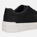 Cropped side view of a black bugatti sneaker with a solid white sole.

