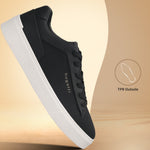 Side view of a black bugatti Gunter comfort sneaker with a white sole.
