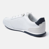 White comfort sneaker by Bugatti featuring a sporty design, textured upper, and dark blue accents.
