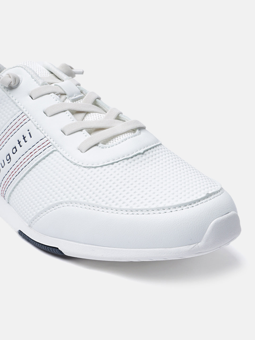 White sneaker by Bugatti, showing a textured mesh upper with striped detailing and matching laces.