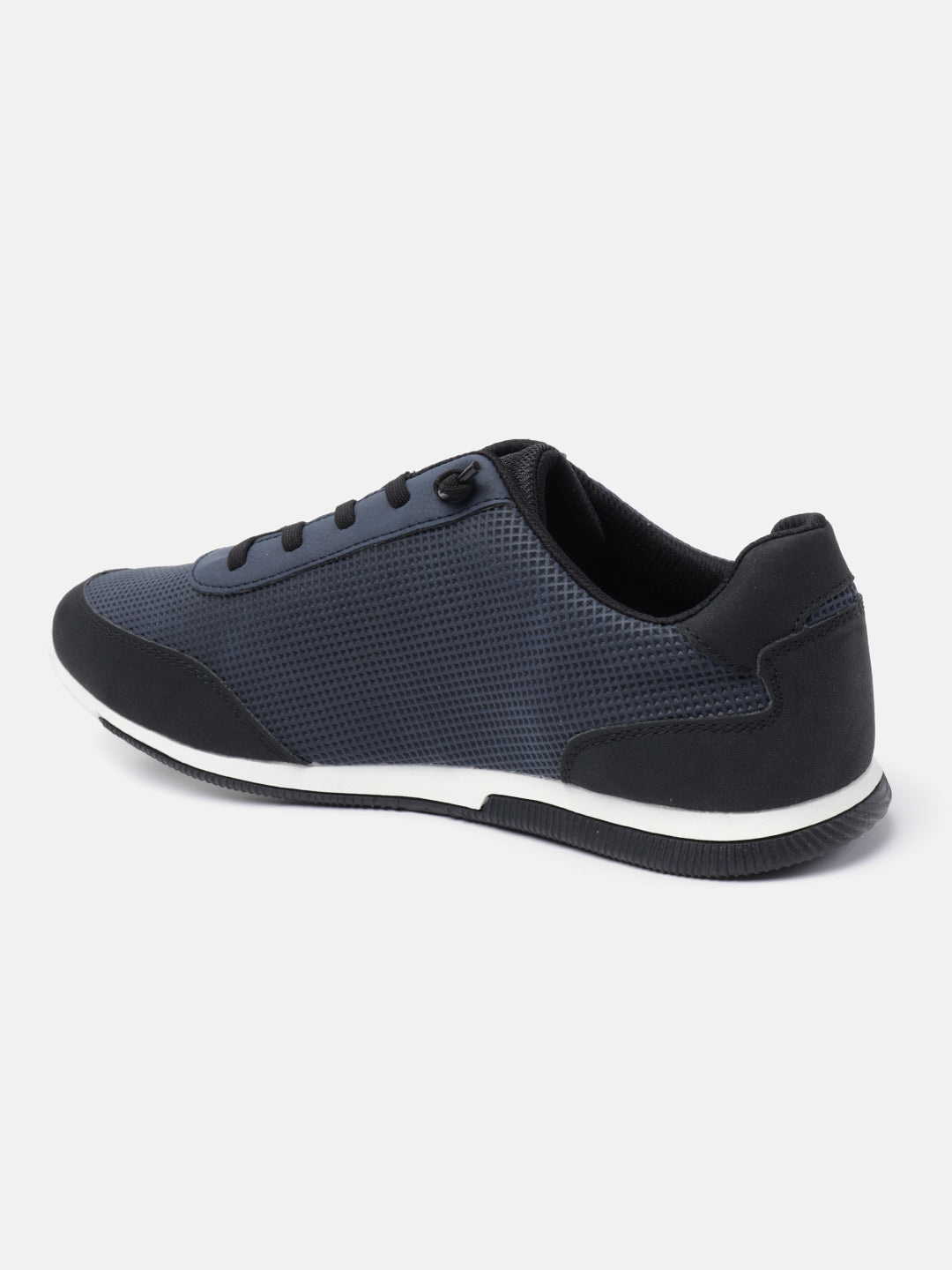 Dark blue comfort sneaker by bugatti with black trim and white accents on the sole, in side view.