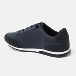 Dark blue comfort sneaker by bugatti with black trim and white accents on the sole, in side view.
